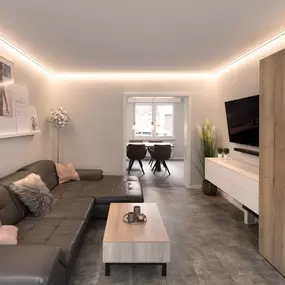 Modernes Wohnzimmer mit Ecksofa, LED-Beleuchtung, Fernseher und Holzmöbeln.